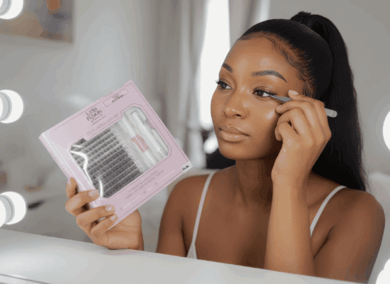 DIY Cluster Lash Kit Woman applying DIY cluster lashes using EVARA Lash Kit at vanity
